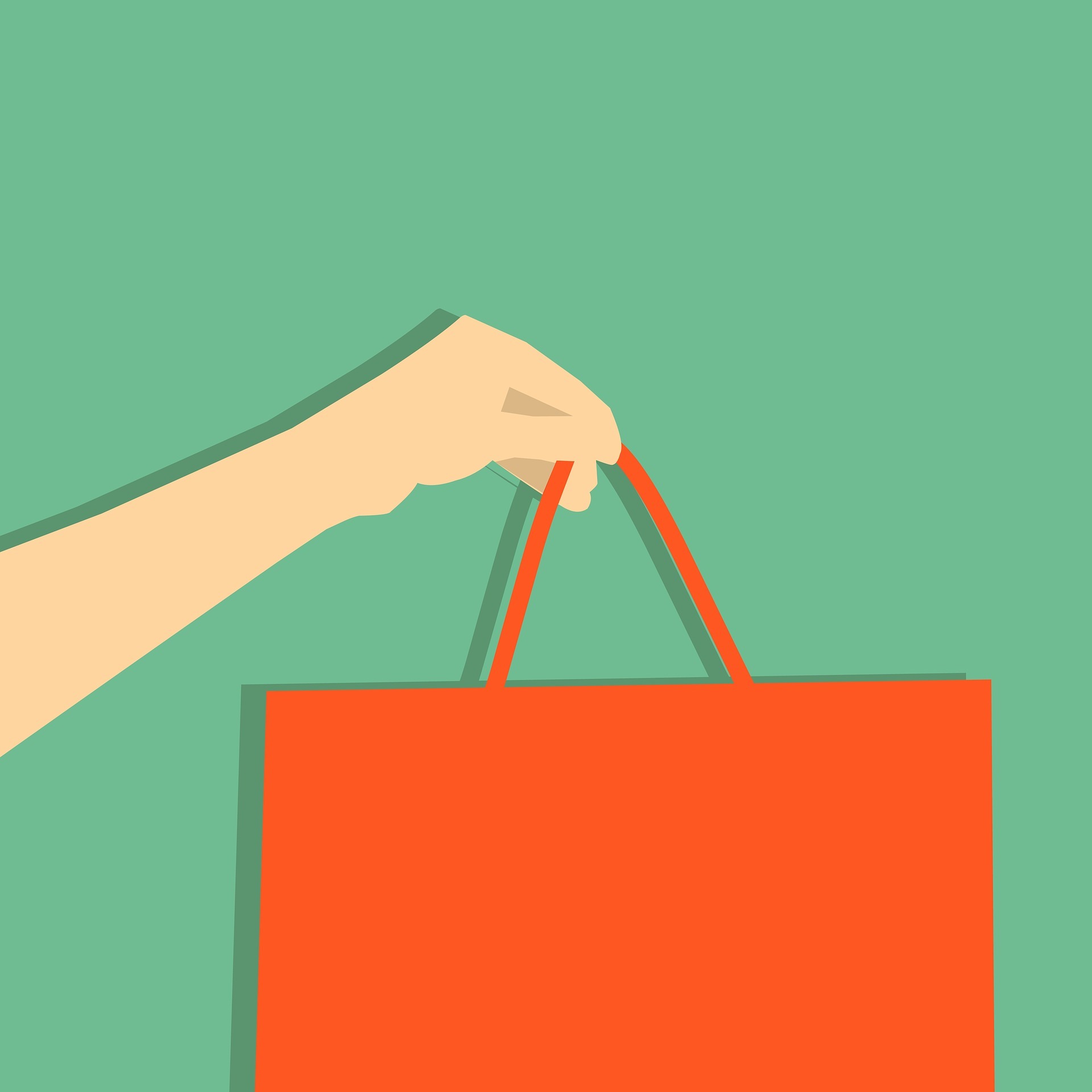 A hand holding a shopping bag A hand holding a shopping bag
